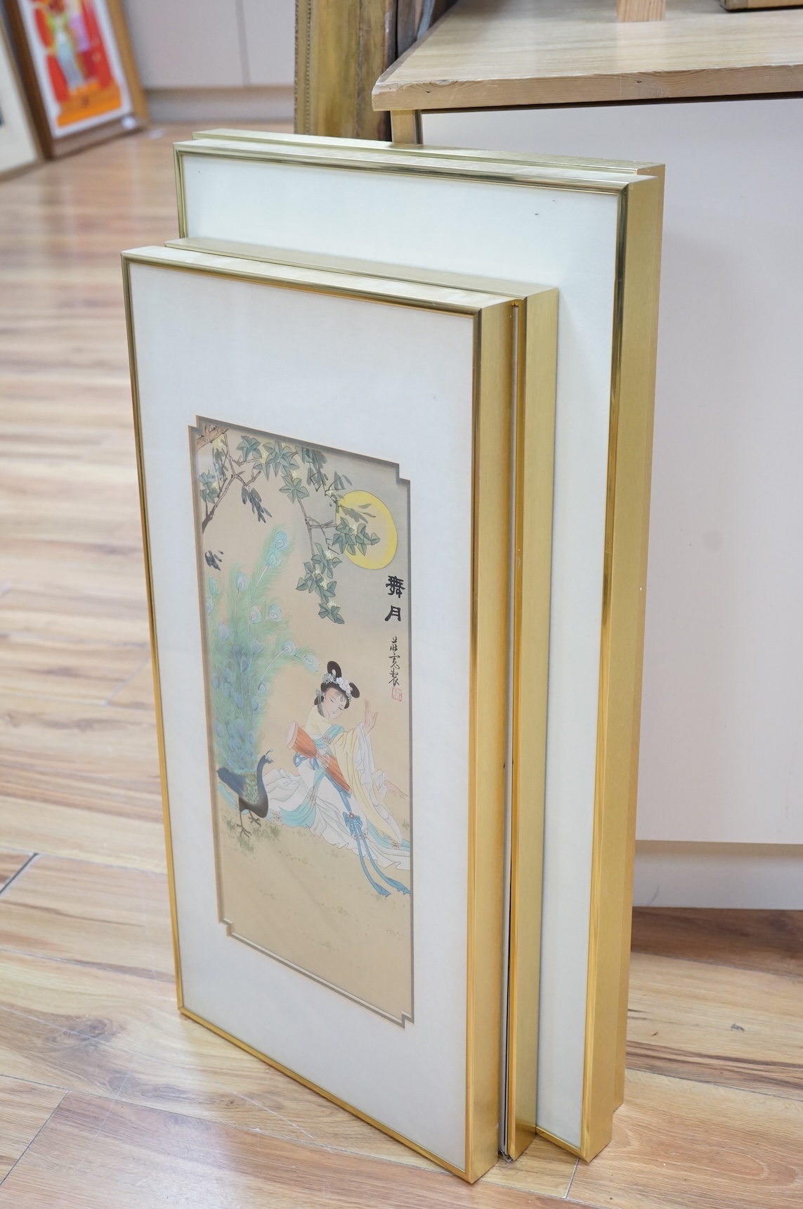 Chinese school, set of four watercolours, Geisha girls before trees and flowers, each signed with character marks and red seal mark, largest 59 x 28cm